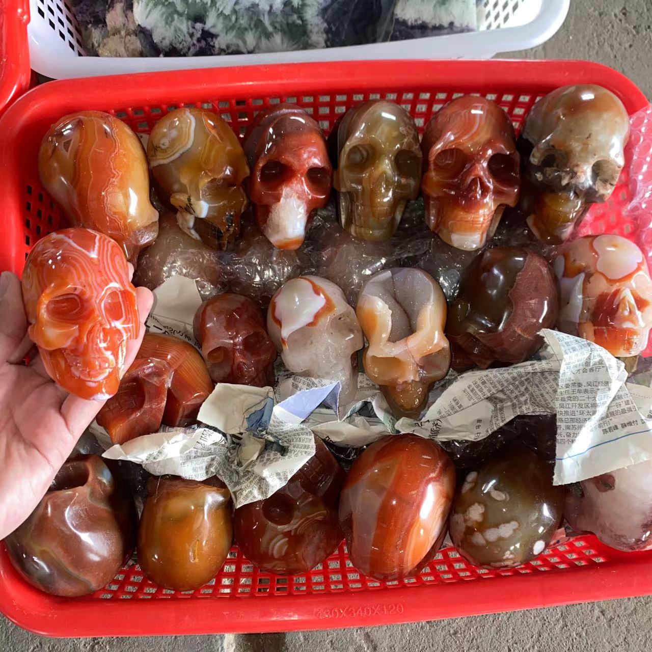 Red agate skull, price by kg