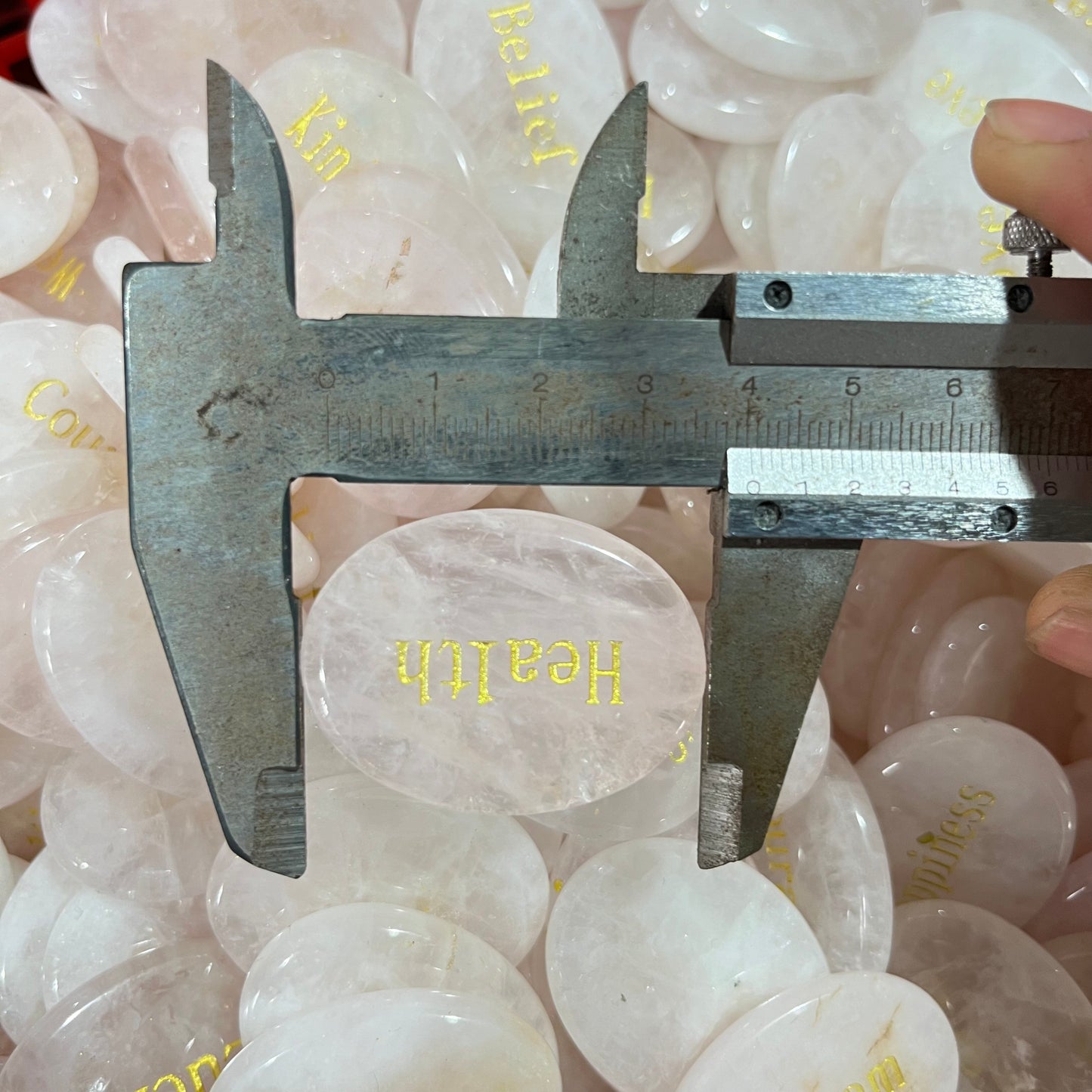 Rose quartz printed palm stone 40mm, price by kg