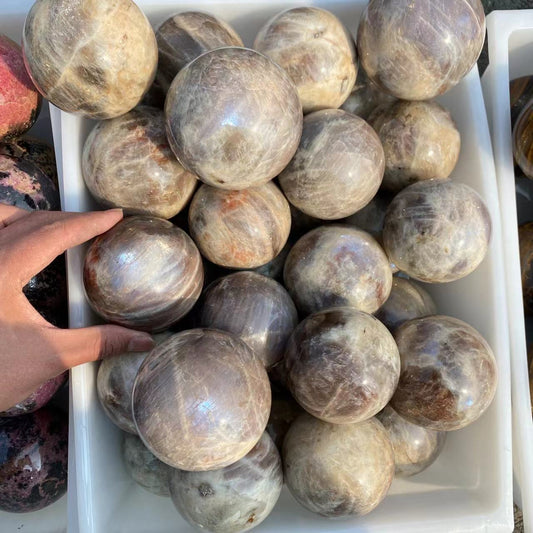 Moonstone and sunstone sphere, price by kg
