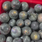 Purple and red labradorite sphere, price by kg